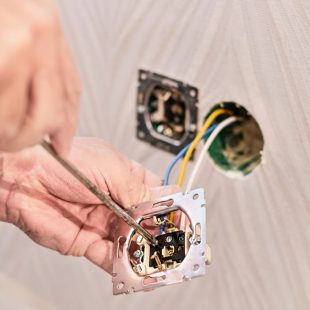 hands-electrician-installing-electrical-outlet-new-house-assembly-electrical-network-room-installation-electrical-network